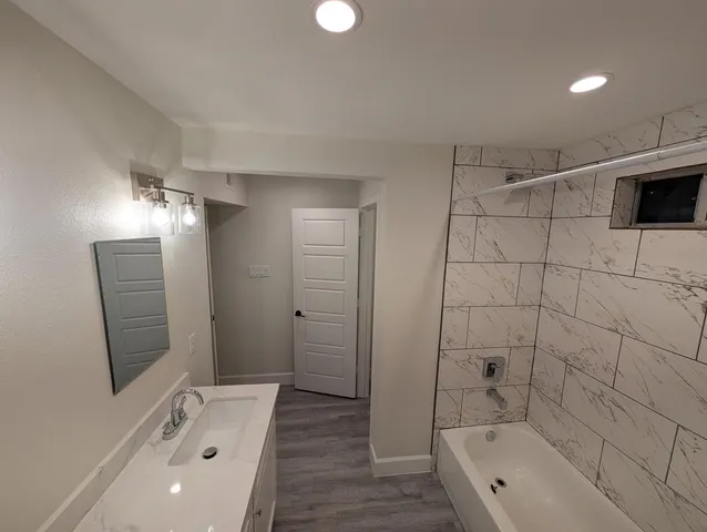 a bathroom with a sink and a bathtub