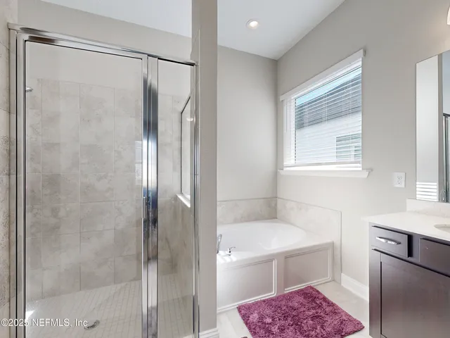 a bathroom with a shower a sink and a toilet