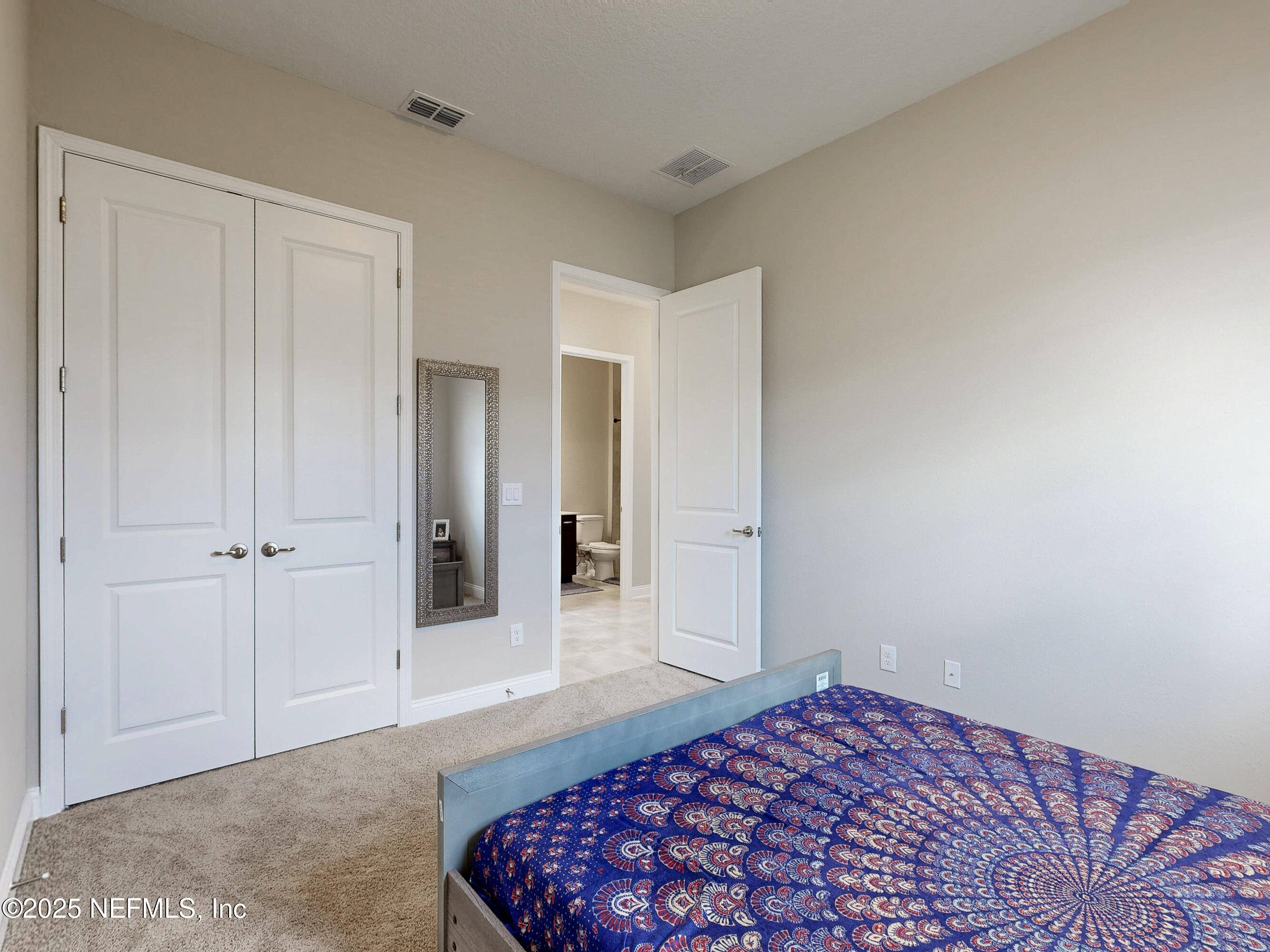 158 Holly Rdg Way St. Augustine, FL 32092 - Photo 16 of 46 a bedroom with a bed and a dresser