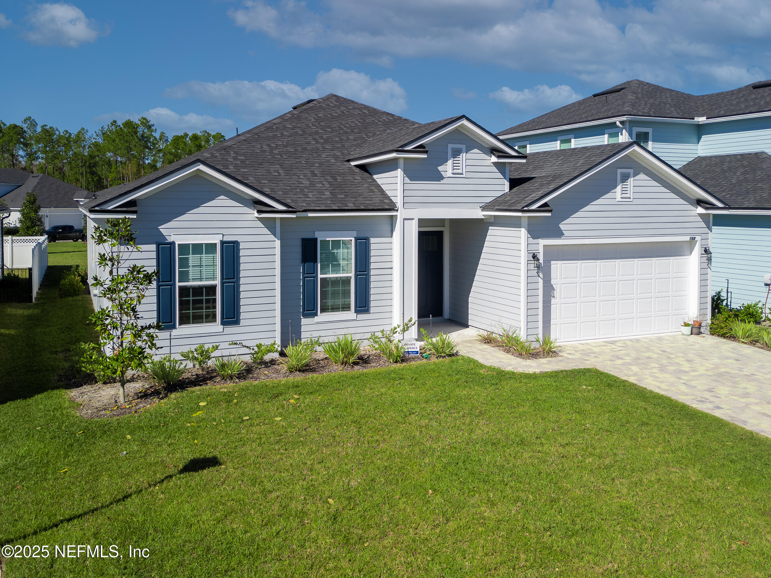 158 Holly Rdg Way St. Augustine, FL 32092 - Photo 2 of 46 front view of a house with a yard