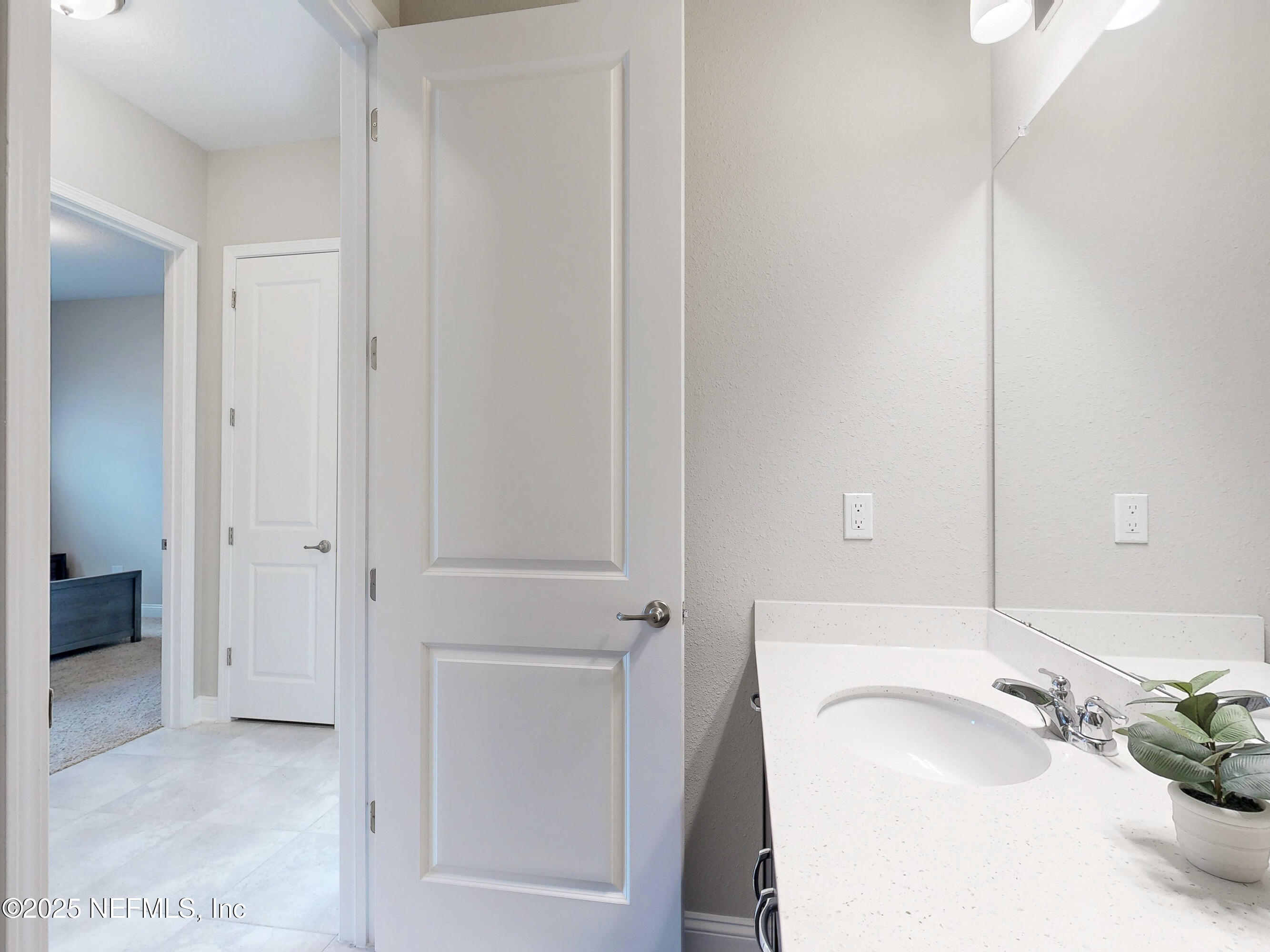 158 Holly Rdg Way St. Augustine, FL 32092 - Photo 24 of 46 a bathroom with a sink and a mirror