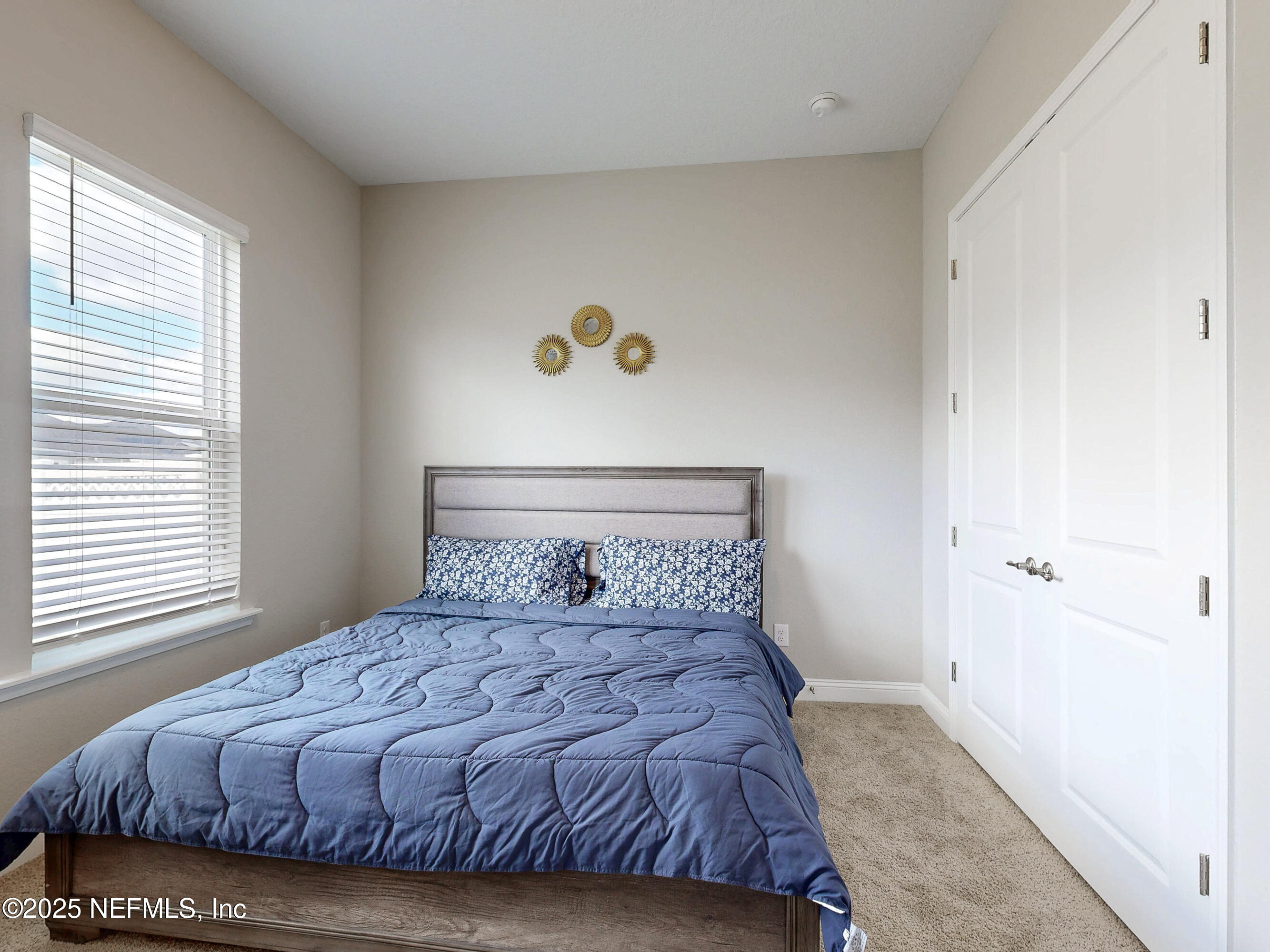 158 Holly Rdg Way St. Augustine, FL 32092 - Photo 26 of 46 a bedroom with a bed and window