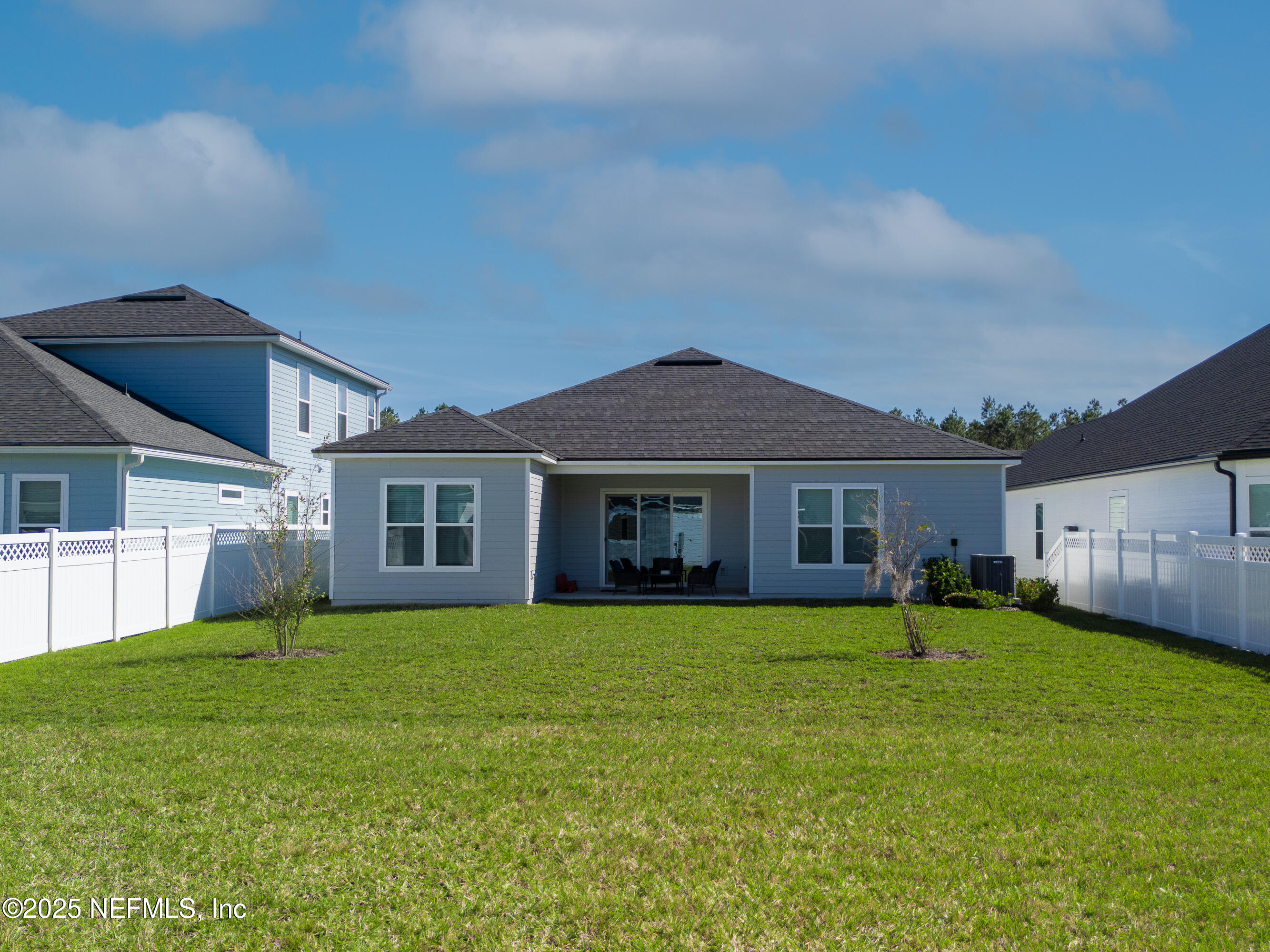 158 Holly Rdg Way St. Augustine, FL 32092 - Photo 32 of 46 a view of a house with a yard and large trees