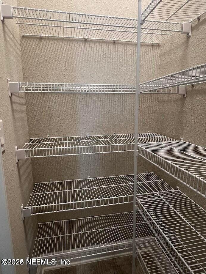 158 Holly Rdg Way St. Augustine, FL 32092 - Photo 36 of 46 a view of a tennis net with a book on a wall