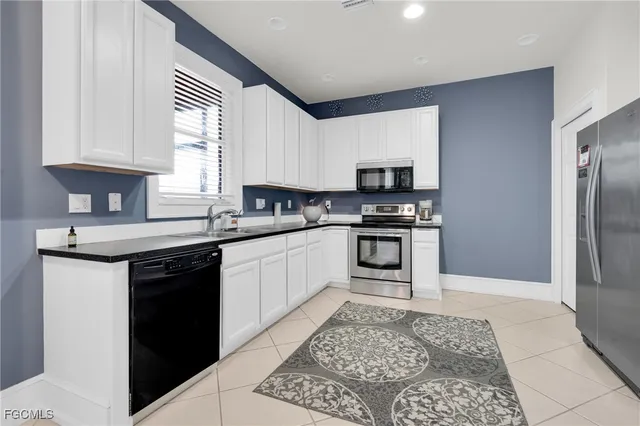 a living room with furniture and a rug