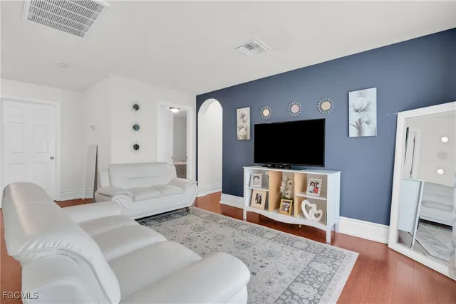 a bathroom with a sink toilet vanity and tub