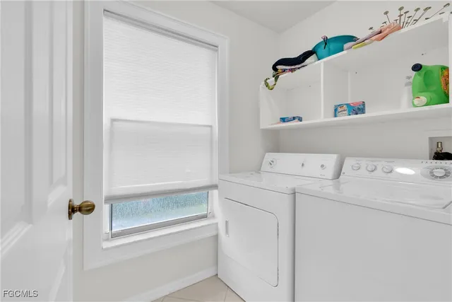 a spacious bedroom with a bed and a dresser in it