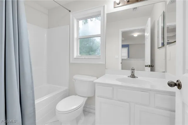 a bathroom with a double vanity sink and mirror