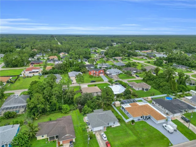 a kitchen with stainless steel appliances granite countertop a refrigerator stove and sink