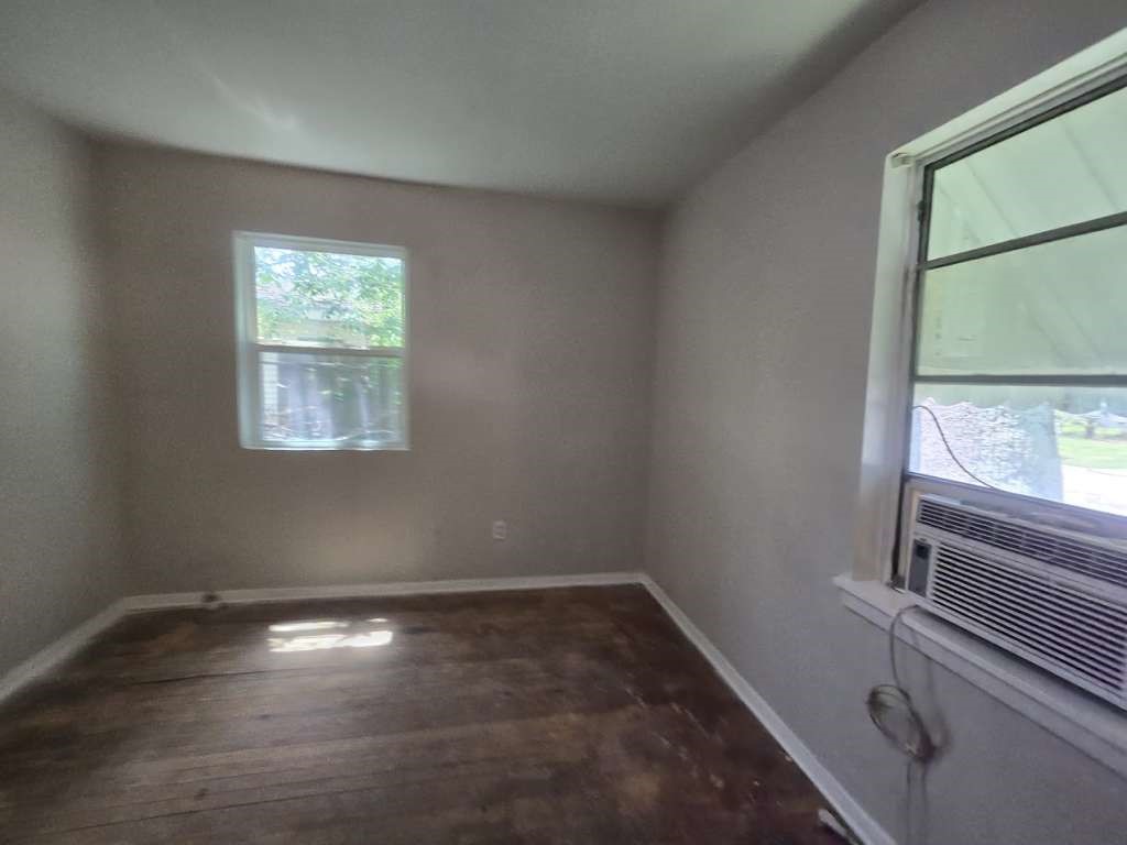 822 Woodhue Street Channelview, TX 77530 - Photo 11 of 14 a view of empty room with wooden floor