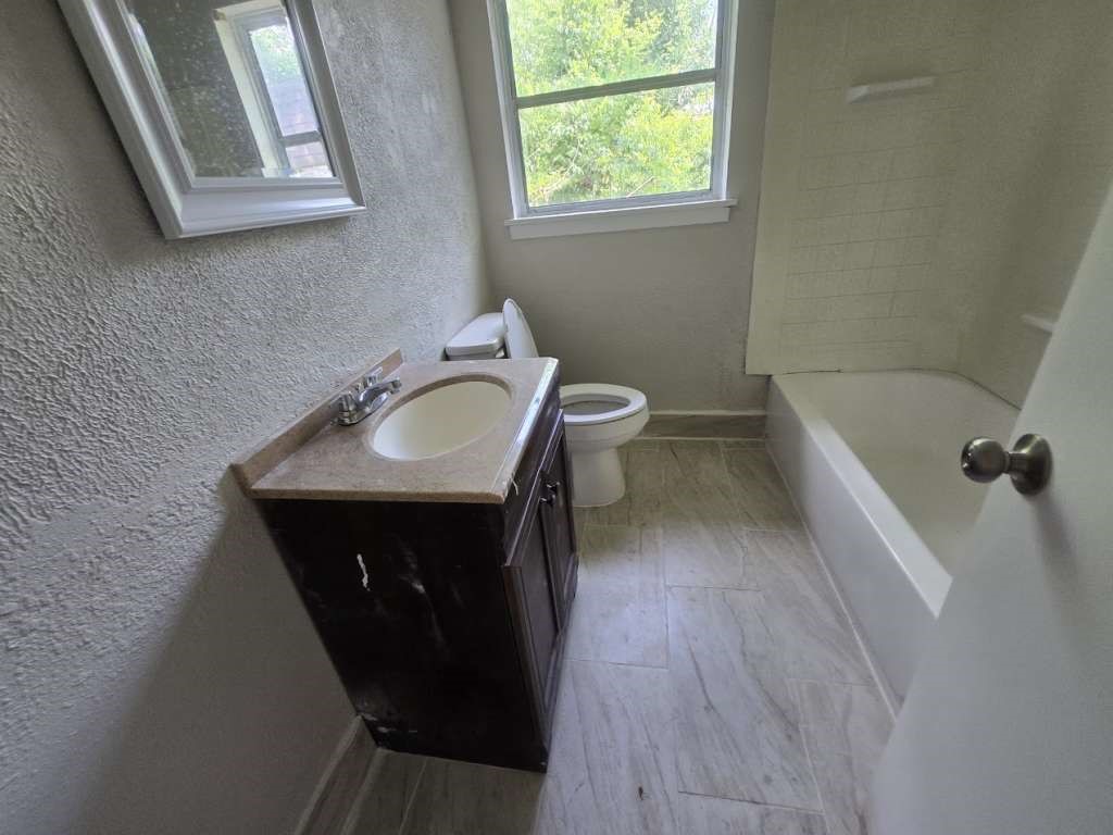 822 Woodhue Street Channelview, TX 77530 - Photo 6 of 11 a bathroom with a sink and a mirror