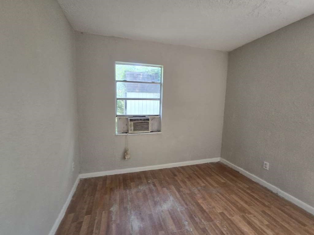 822 Woodhue Street Channelview, TX 77530 - Photo 7 of 11 an empty room with a window