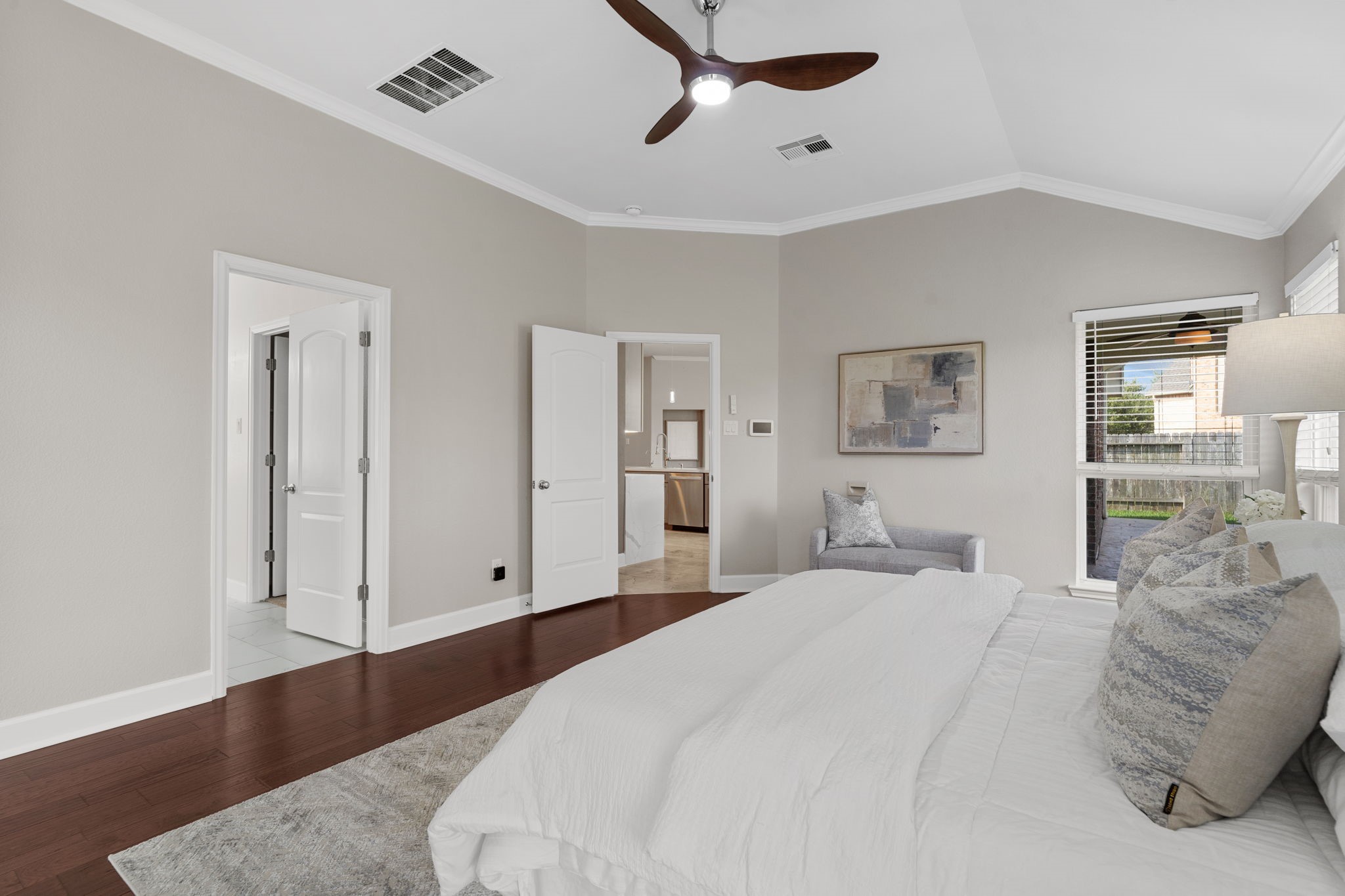 3426 Summer Ranch Drive Katy, TX 77494 - Photo 21 of 48 A spacious layout and elevated ceiling add to the airy feel of the primary bedroom, with plenty of room for oversized furnishings and a comfortable sitting area.