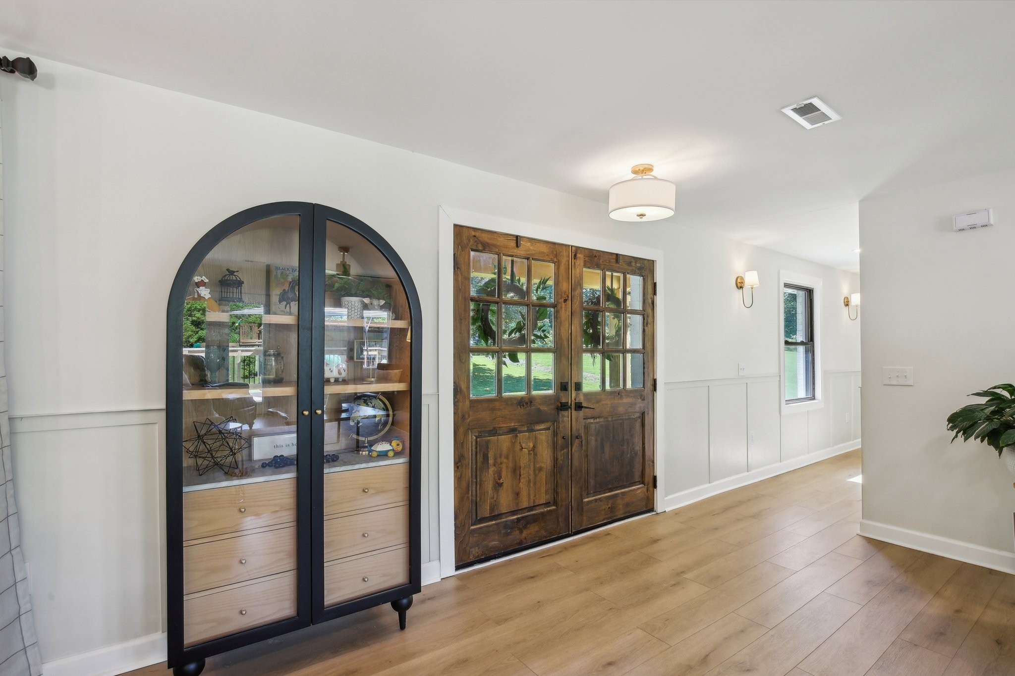 4151 Sadlersville Road Adams, TN 37010 - Photo 6 of 64 a view of a room with wooden floor and garden view