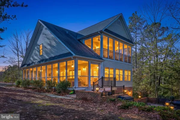 a backyard of a house with outdoor seating
