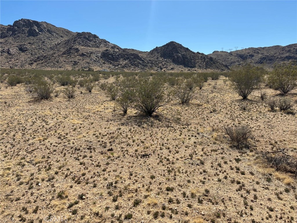 0 Holmes Road Lucerne Valley, CA 92356 - Photo 8 of 8 a view of a large mountain with a mountain in the background