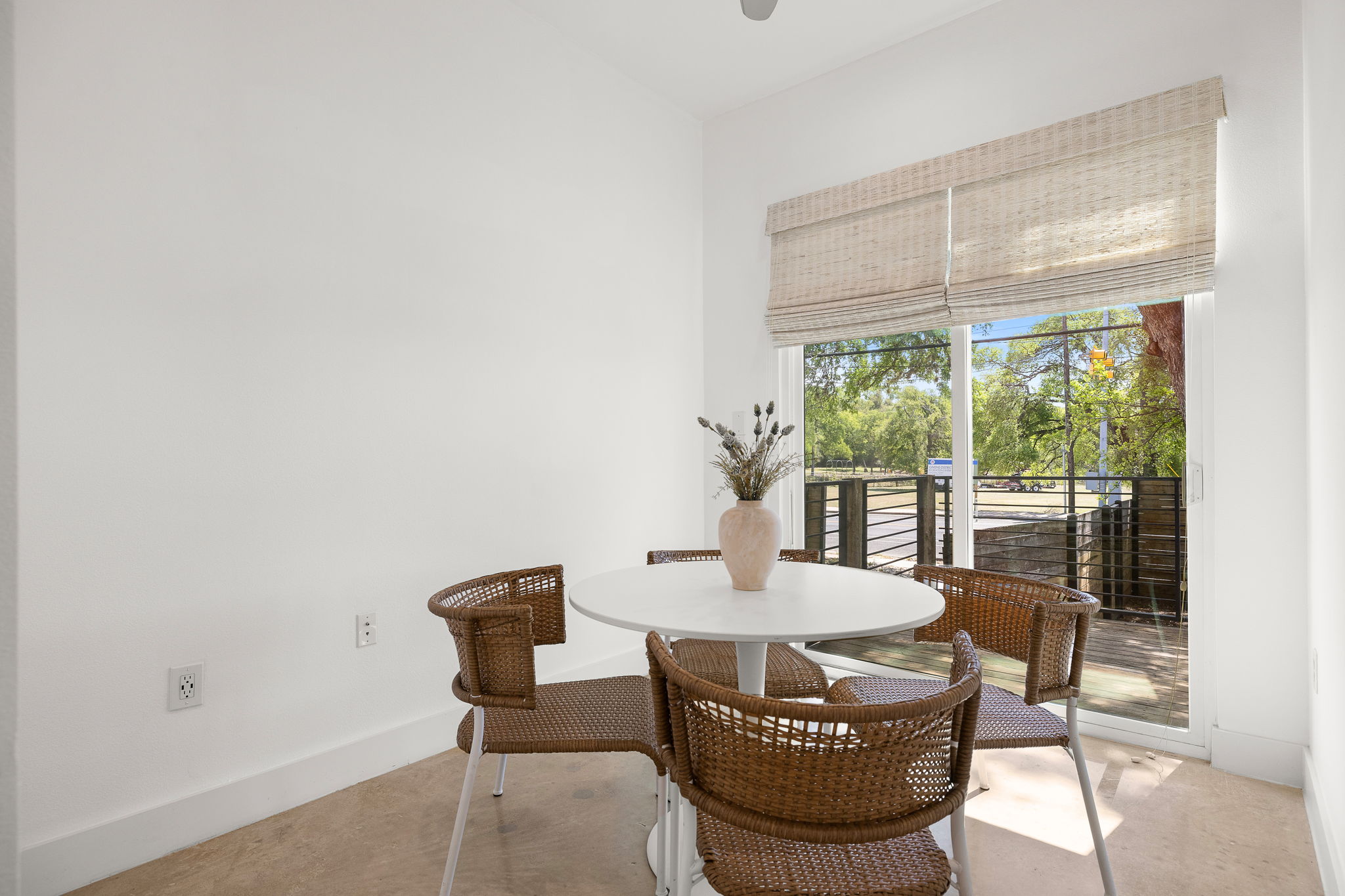 1201 Luna Street Austin, TX 78721 - Photo 13 of 31 Dining space with baseboards and concrete flooring