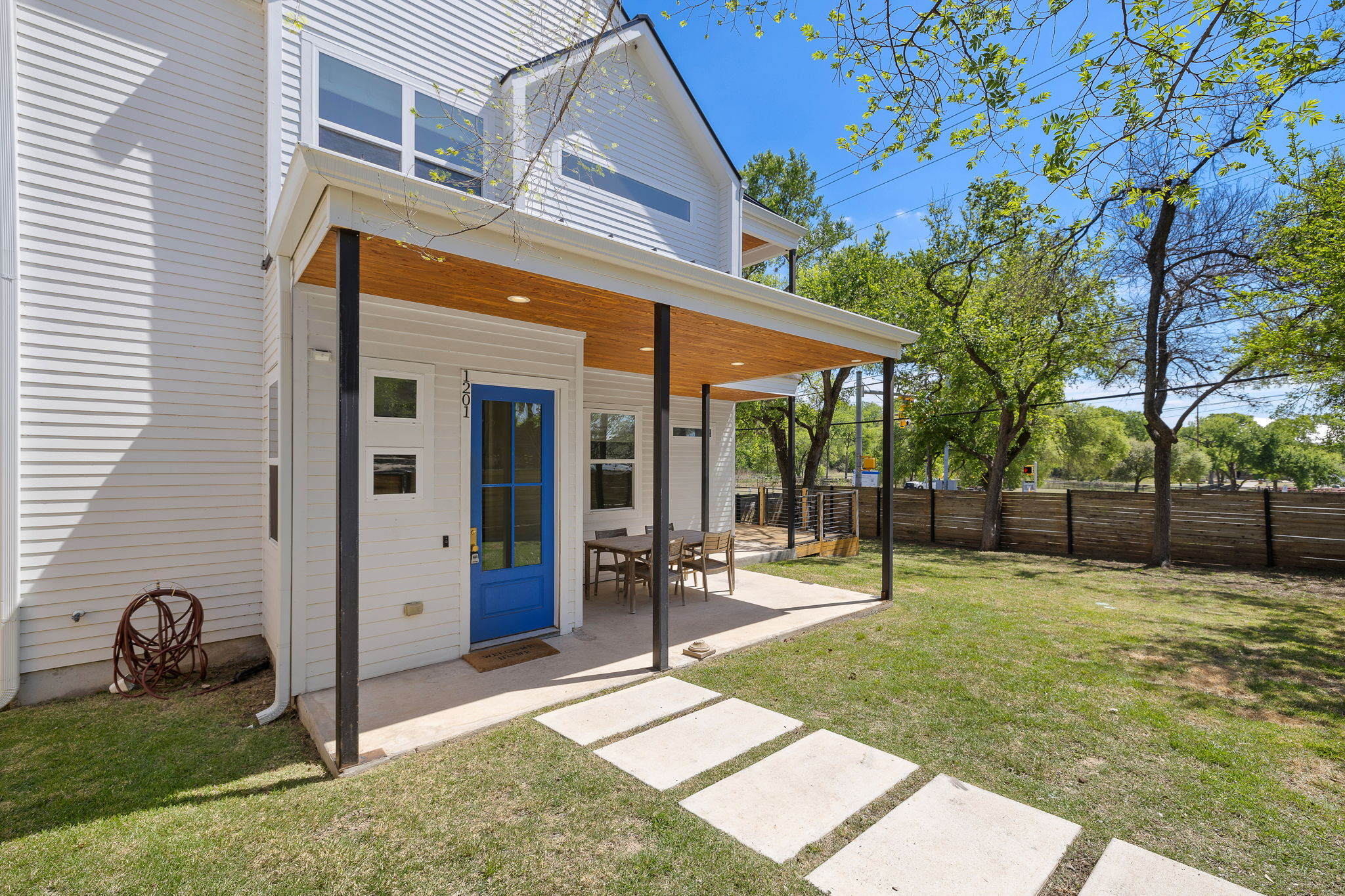1201 Luna Street Austin, TX 78721 - Photo 2 of 31 Rear view of property with a fenced backyard and a patio