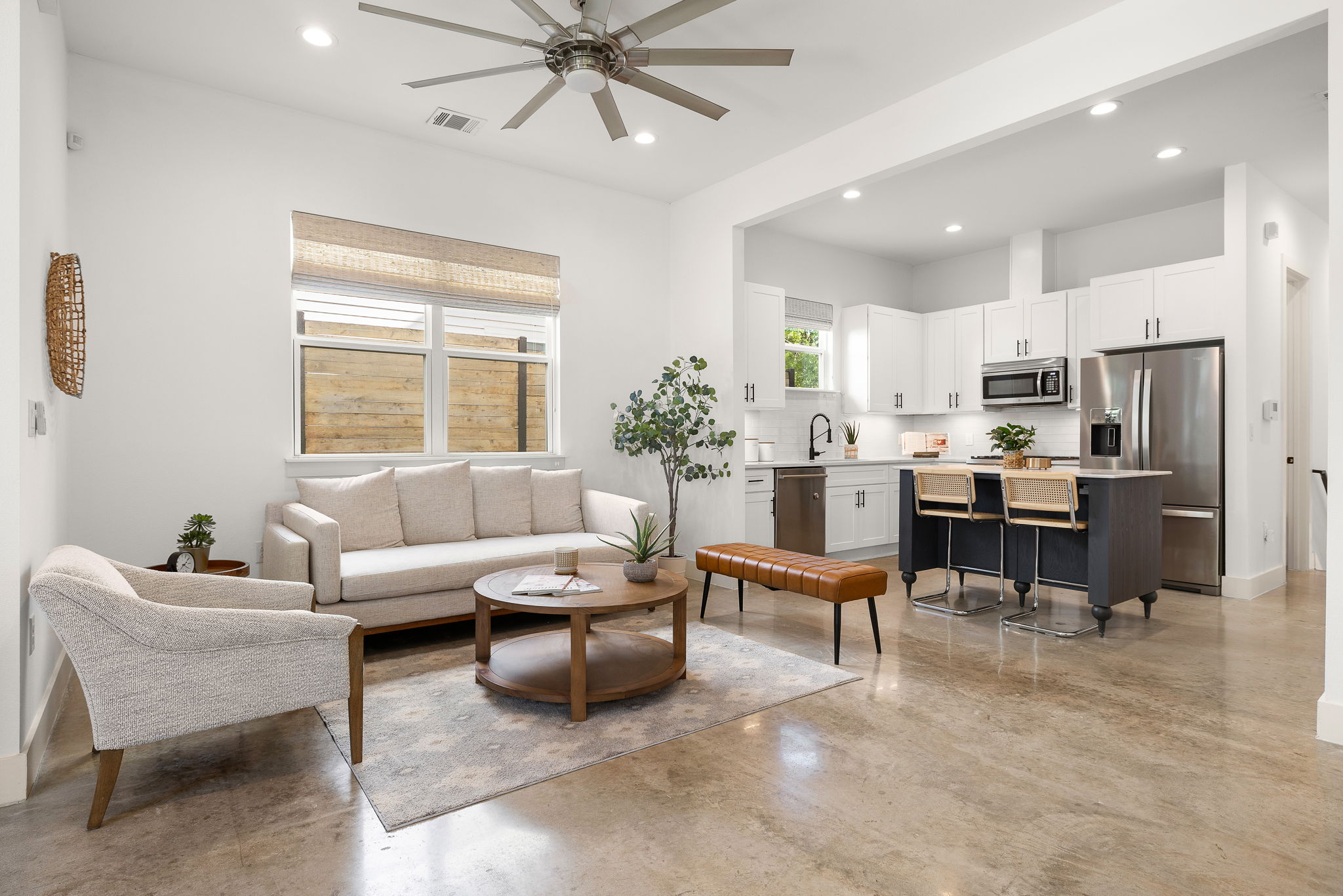 1201 Luna Street Austin, TX 78721 - Photo 3 of 31 Living area with finished concrete flooring, a ceiling fan, and recessed lighting