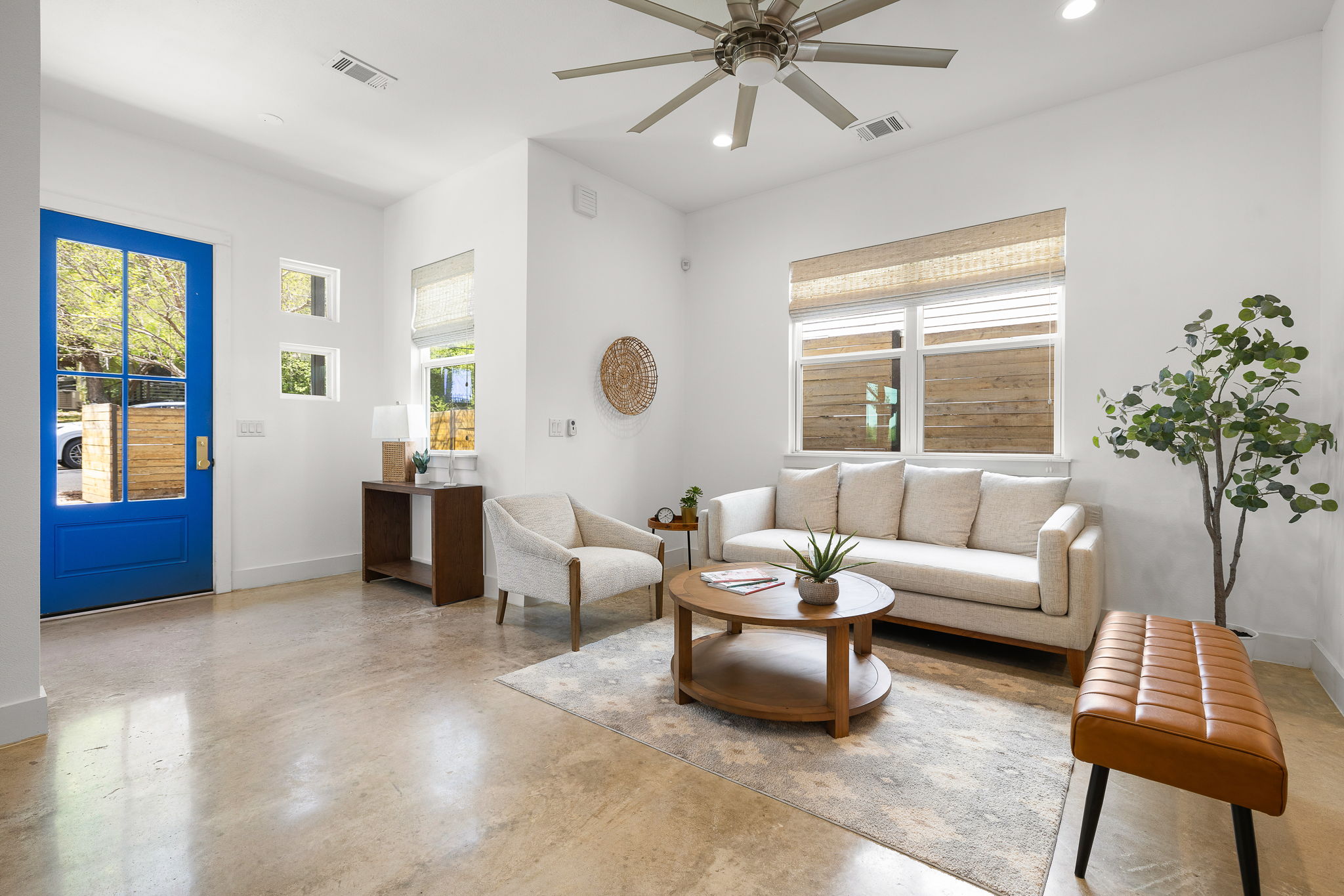 1201 Luna Street Austin, TX 78721 - Photo 5 of 31 Living area featuring finished concrete floors, ceiling fan, and recessed lighting