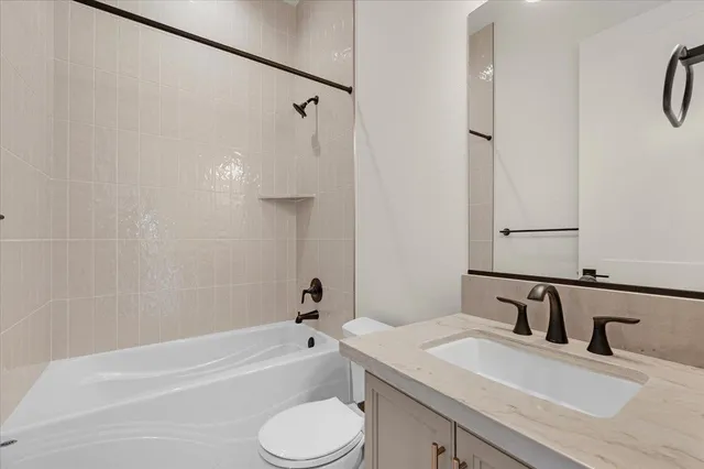 a utility room with sink dryer and washer