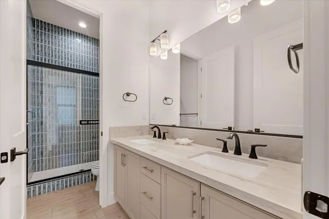 a bathroom with a shower and a mirror