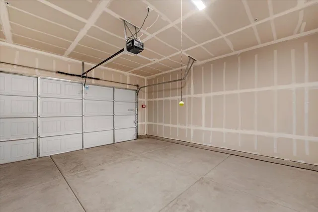 an aerial view of residential houses with outdoor space and river