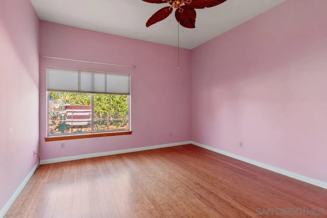 13150 Glen Circle Road Poway, CA 92064 - Photo 33 of 48 an empty room with a window and a ceiling fan
