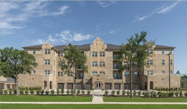 a large building with a yard in front of it