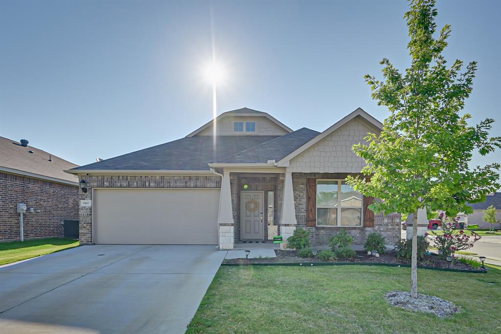 10621 Alpine Meadow Lane Fort Worth, TX 76140 - Photo 1 of 35 a front view of a house with a yard and garage