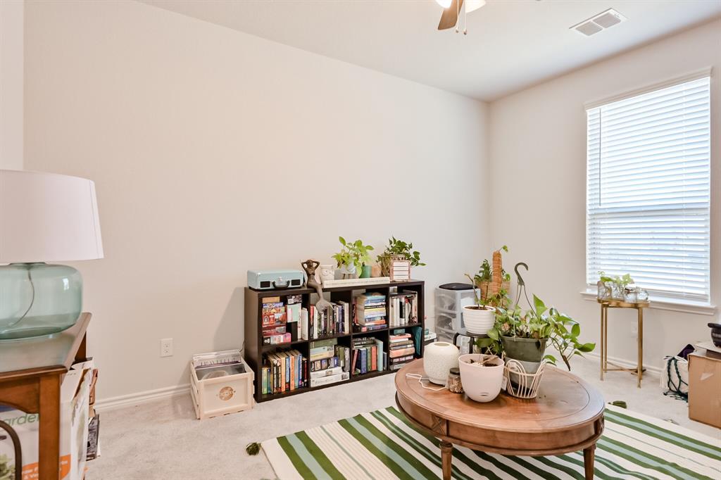 10621 Alpine Meadow Lane Fort Worth, TX 76140 - Photo 11 of 35 a dining room with furniture and a potted plant
