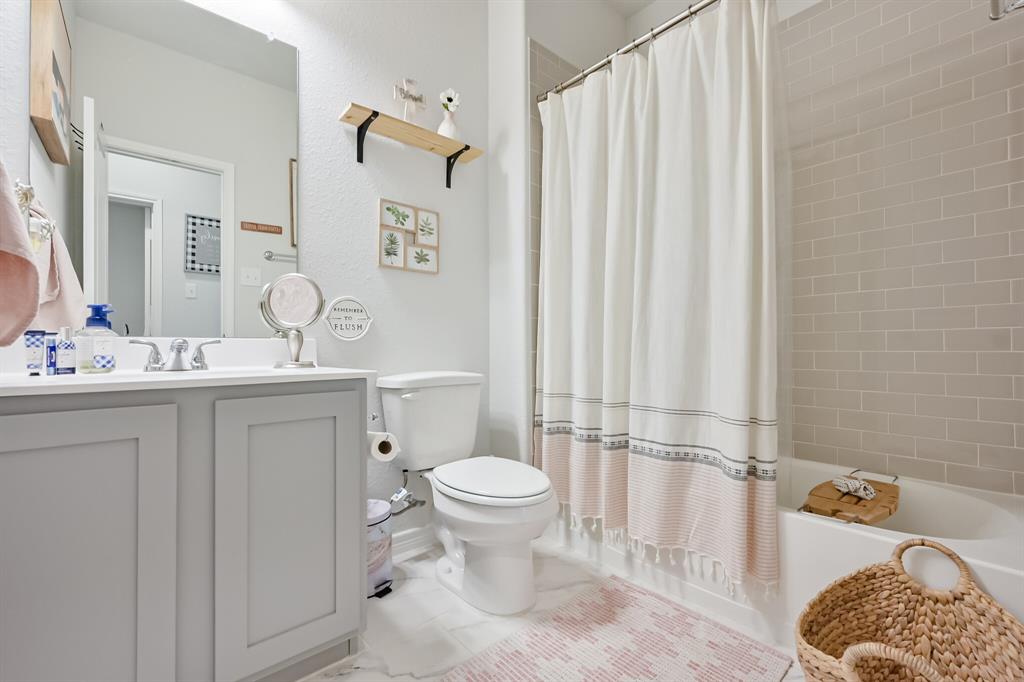 10621 Alpine Meadow Lane Fort Worth, TX 76140 - Photo 12 of 35 a bathroom with a sink toilet and shower