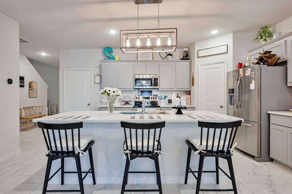 10621 Alpine Meadow Lane Fort Worth, TX 76140 - Photo 15 of 35 a view of a dining room with furniture