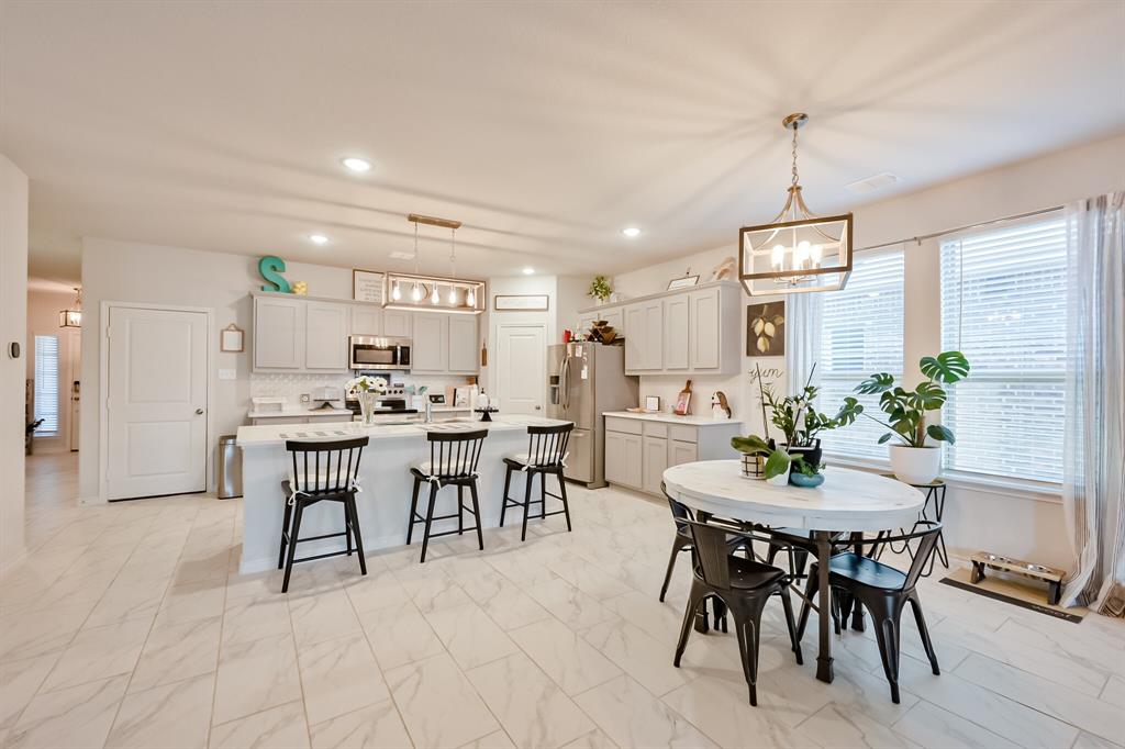 10621 Alpine Meadow Lane Fort Worth, TX 76140 - Photo 19 of 35 a view of a dining room with furniture