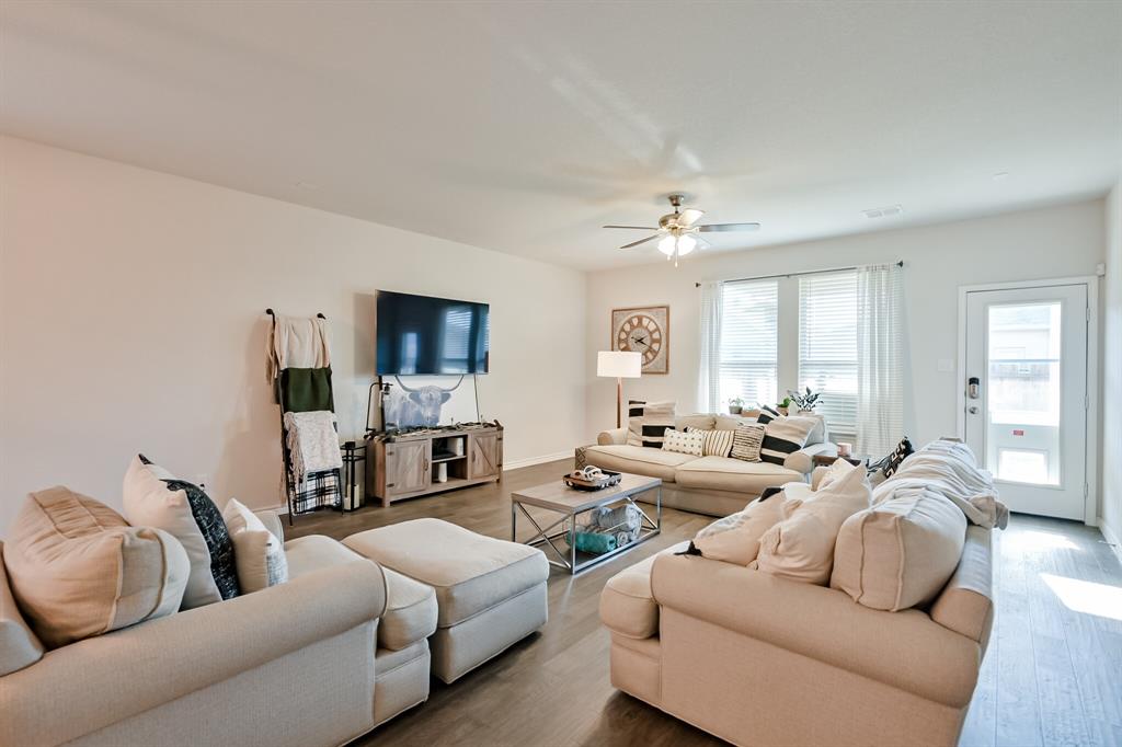 10621 Alpine Meadow Lane Fort Worth, TX 76140 - Photo 20 of 35 a living room with furniture flat screen tv and window