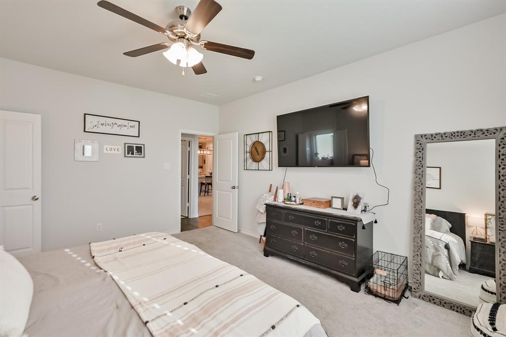 10621 Alpine Meadow Lane Fort Worth, TX 76140 - Photo 25 of 35 a bedroom with a bed and a flat screen tv