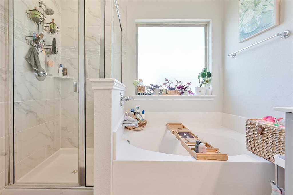 10621 Alpine Meadow Lane Fort Worth, TX 76140 - Photo 26 of 35 a bathroom with a tub and a shower