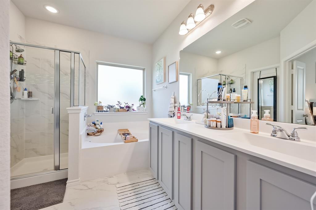 10621 Alpine Meadow Lane Fort Worth, TX 76140 - Photo 27 of 35 a bathroom with a double vanity sink mirror and shower