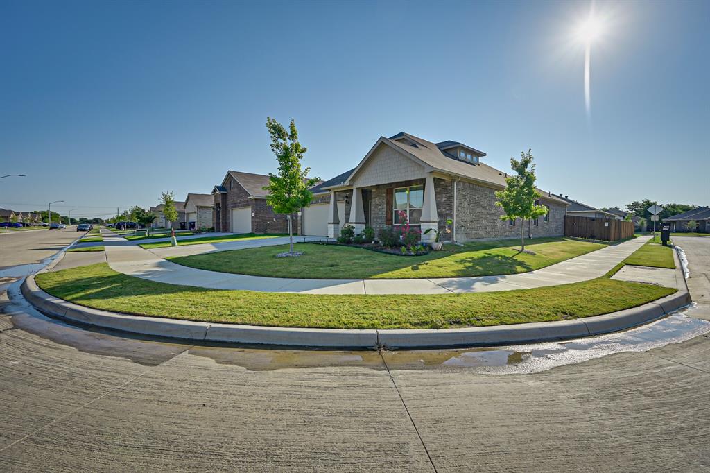 10621 Alpine Meadow Lane Fort Worth, TX 76140 - Photo 3 of 35 a view of a white house with a small pool and a yard