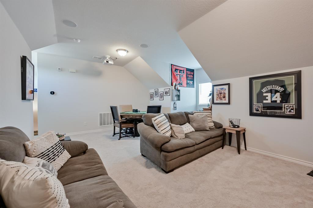 10621 Alpine Meadow Lane Fort Worth, TX 76140 - Photo 32 of 35 a living room with furniture and a bookshelf