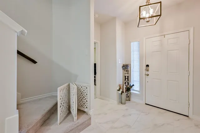 a bedroom with a bed and a wall painting