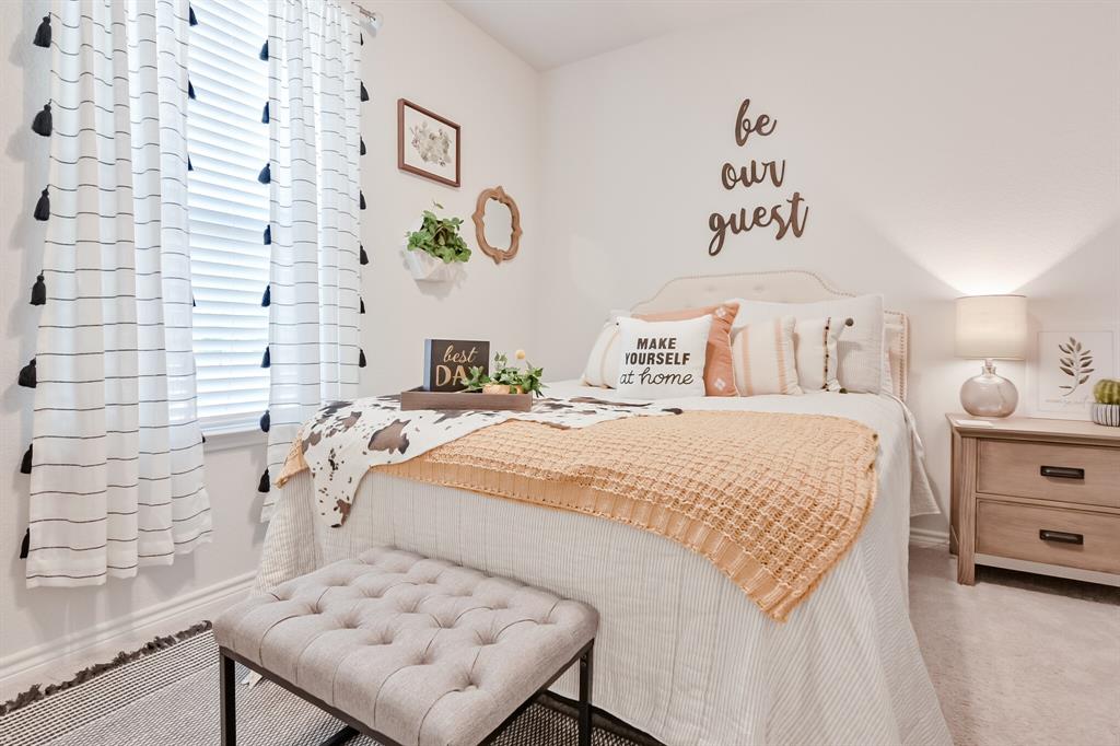 10621 Alpine Meadow Lane Fort Worth, TX 76140 - Photo 9 of 35 a bedroom with a bed and a wall painting