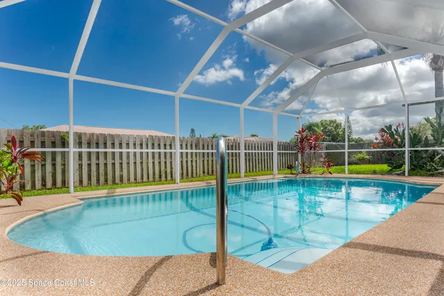 a view of a swimming pool with a patio