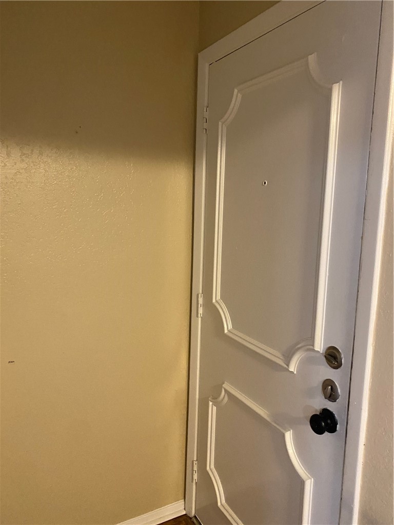 806 West 24th Street, Unit 308 Austin, TX 78705 - Photo 11 of 25 an empty room with a door
