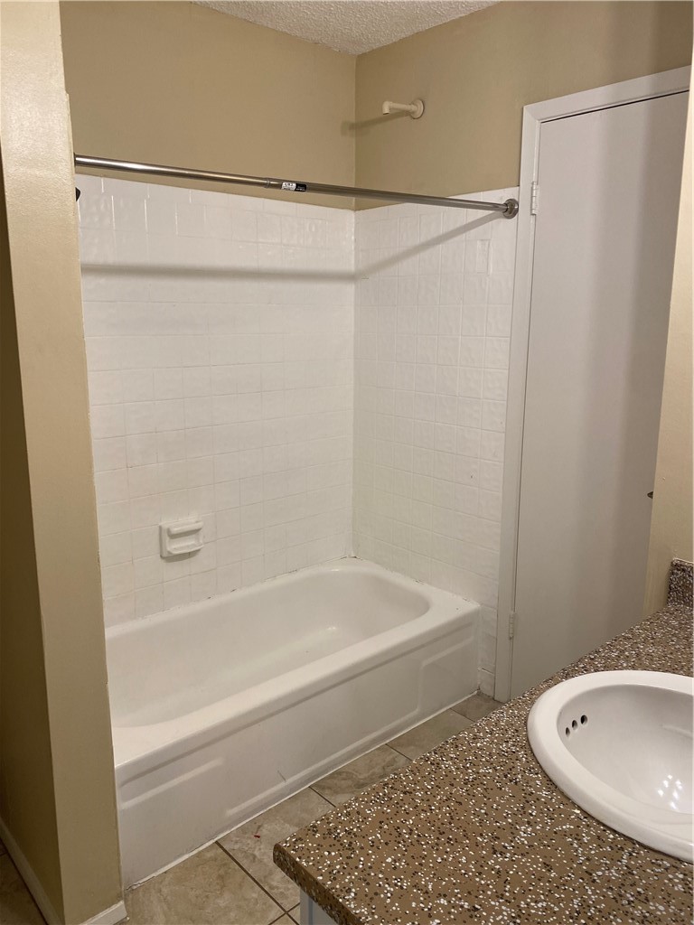 806 West 24th Street, Unit 308 Austin, TX 78705 - Photo 13 of 25 a bathroom with a shower and a bath tub