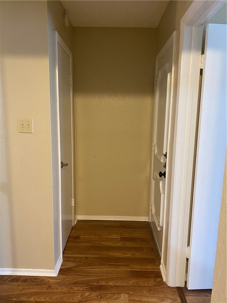 806 West 24th Street, Unit 308 Austin, TX 78705 - Photo 2 of 25 a view of a hallway with wooden floor