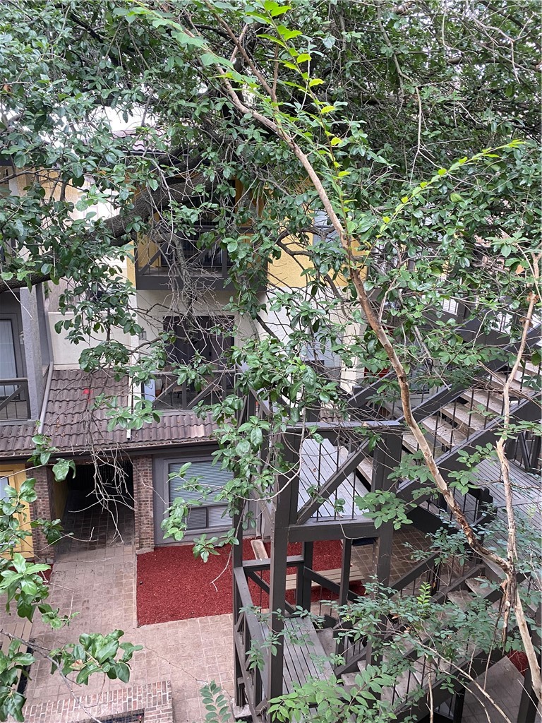 806 West 24th Street, Unit 308 Austin, TX 78705 - Photo 24 of 25 an aerial view of a house with a tree