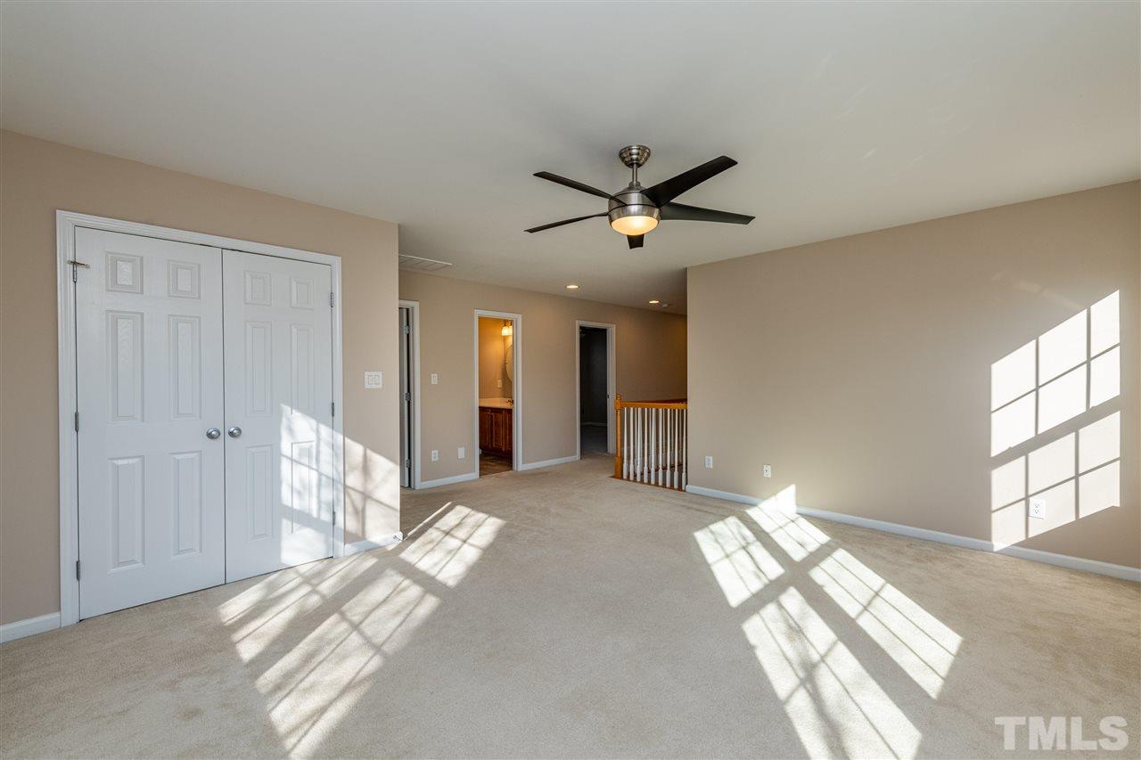 3501 Weir Way Raleigh, NC 27616 - Photo 22 of 30 a view of livingroom with a ceiling fan and window