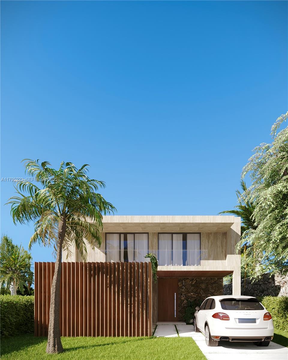 a front view of a house with a garden