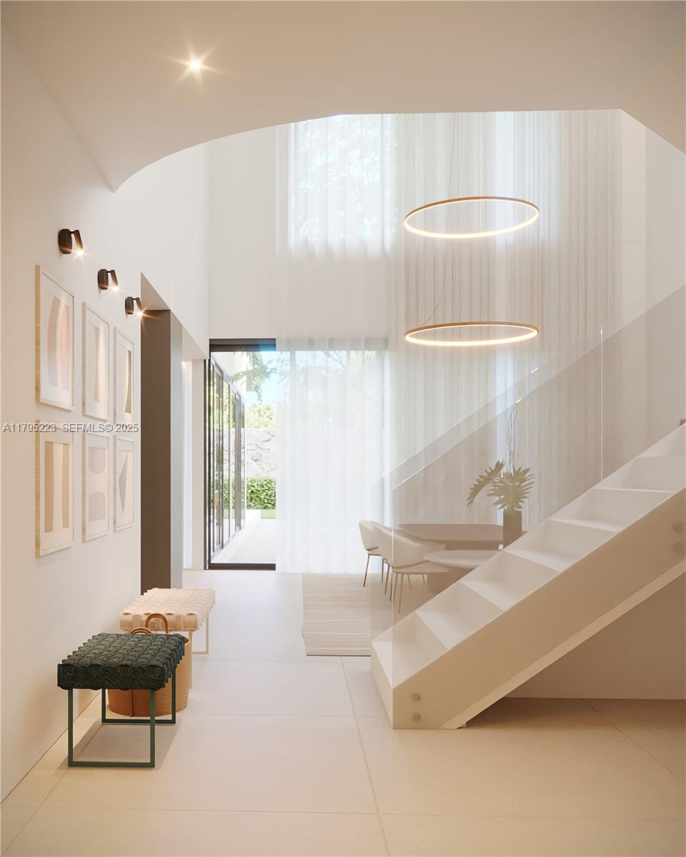 125 Southwest 29th Road Miami, FL 33129 - Photo 3 of 44 a spacious bathroom with a double vanity sink and a bathtub